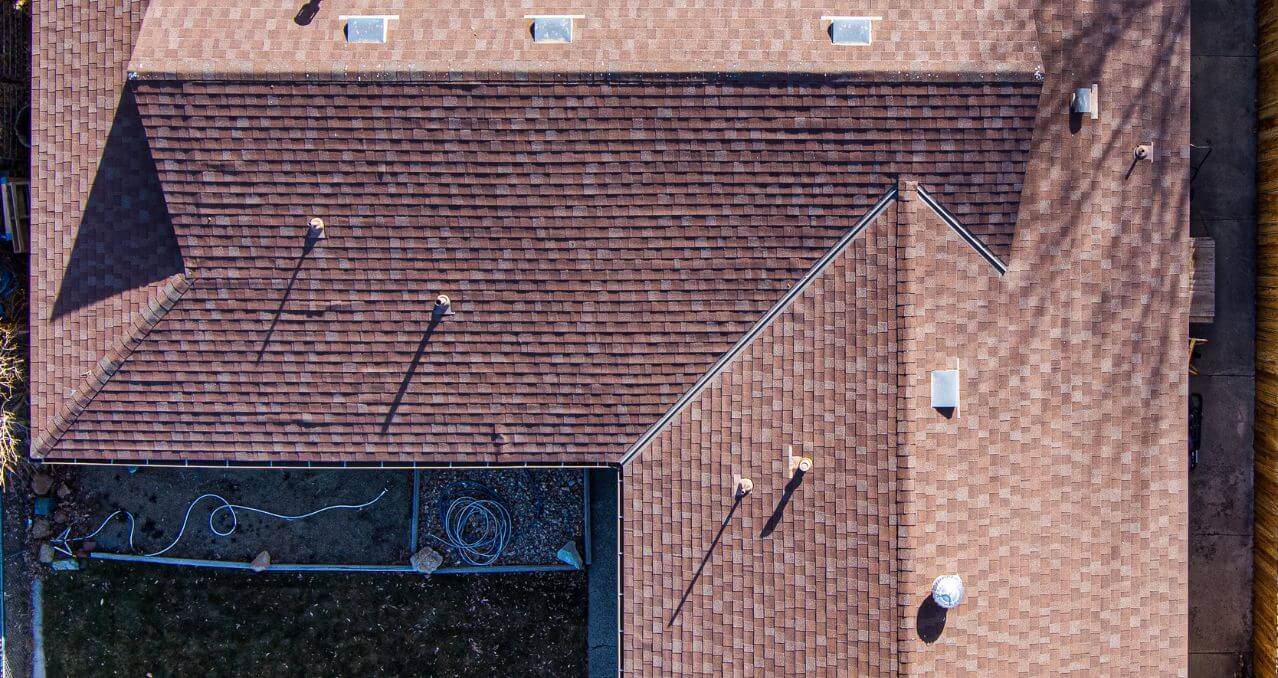 Drone inspecting a residential roof in Enfield for damage assessment